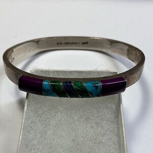Taxco Sterling Silver Hinged Bracelet with multi color inlay. 2 3/8 inch across